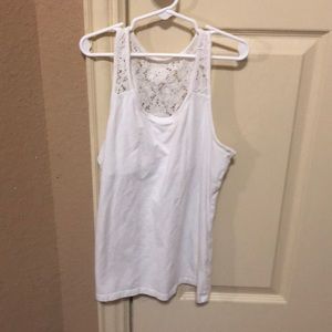 A Tank top with flowers at the top of the shirt